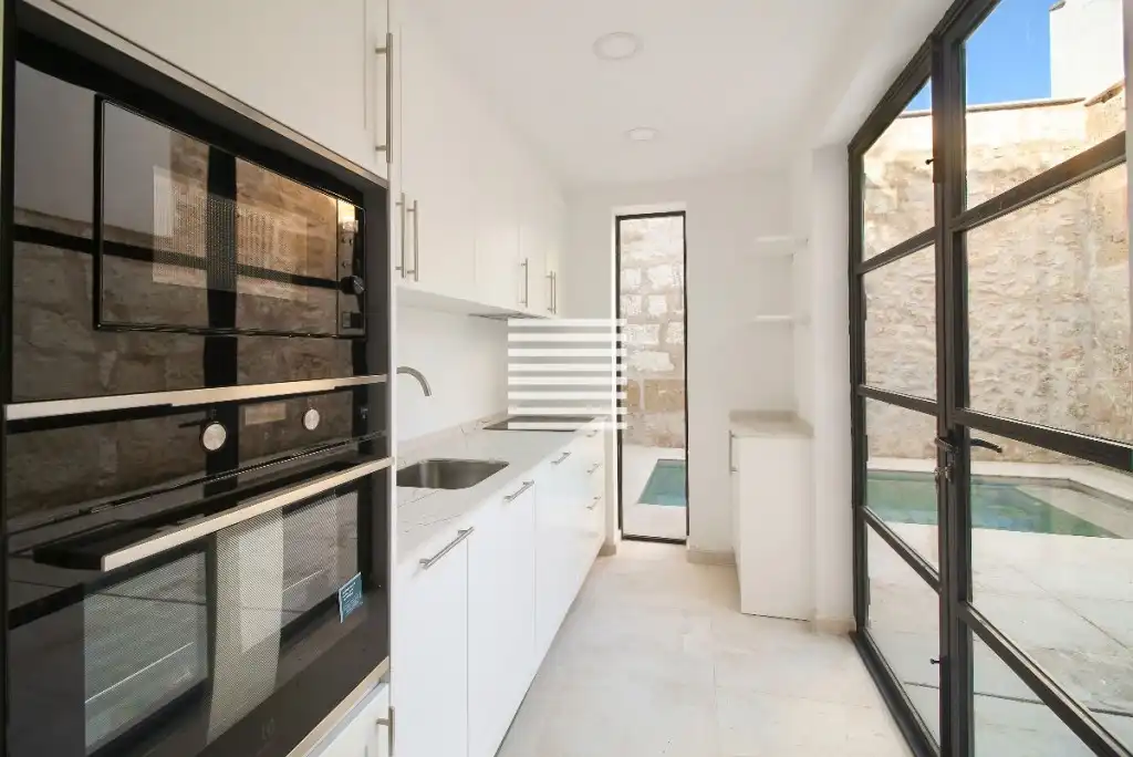 Küche von Einfamilien-Reihenhaus zum Verkauf in Pollença mit Klimaanlage, Terrasse und Schwimmbad