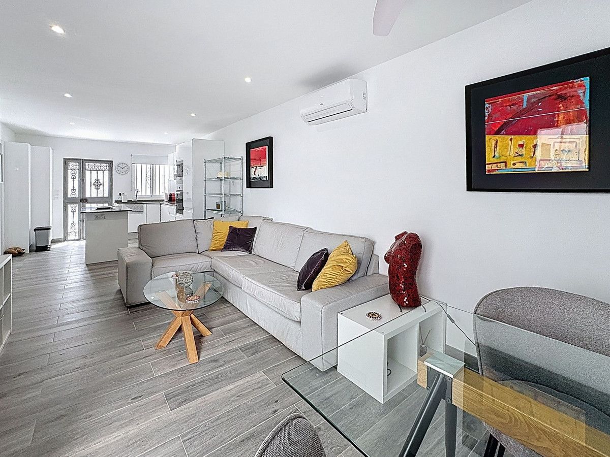 Sala de estar de Casa adosada en venta en Mijas con Aire acondicionado, Calefacción y Terraza