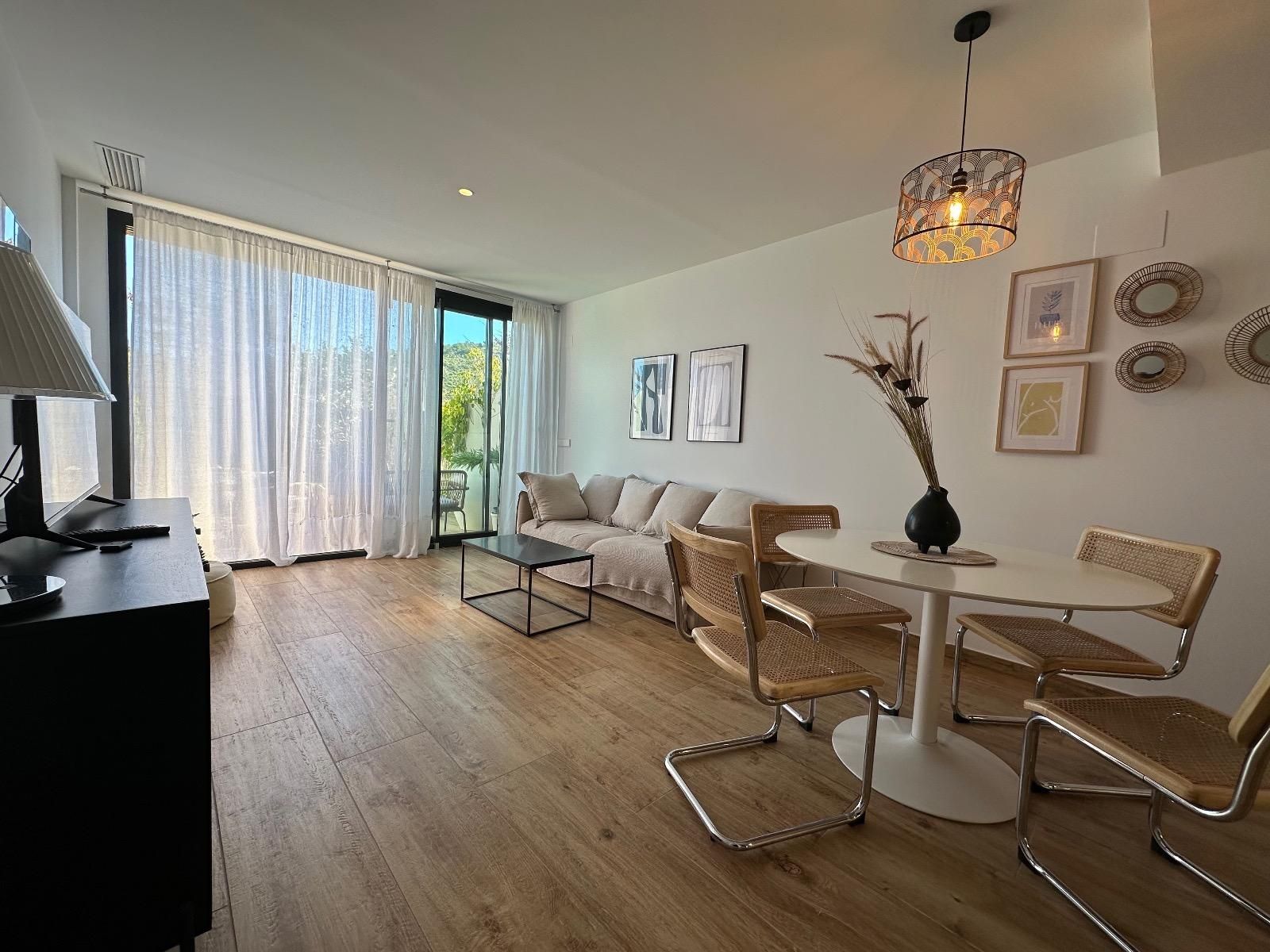 Sala d'estar de Apartament de lloguer en Villajoyosa / La Vila Joiosa amb Aire condicionat, Jardí privat i Terrassa