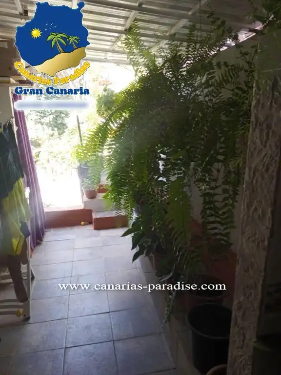 Terrasse von Einfamilien-Reihenhaus zum Verkauf in Mogán mit Klimaanlage, Privatgarten und Möbliert