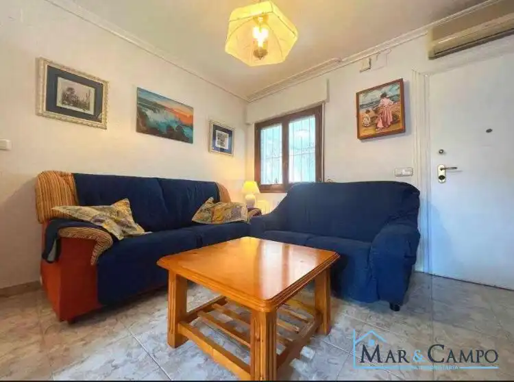 Sala de estar de Casa adosada en venta en Los Alcázares con Aire acondicionado, Jardín privado y Amueblado