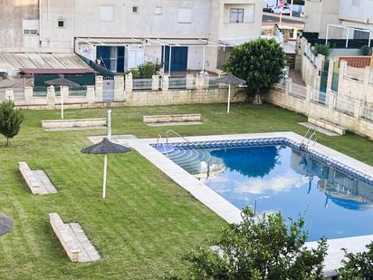 Piscina de Casa adosada en venda en El Portil amb Aire condicionat i Terrassa