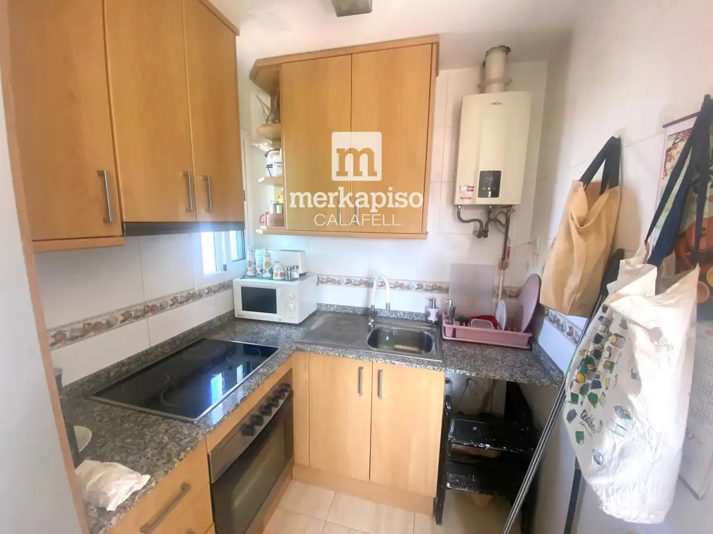 Kitchen of Attic for sale in Calafell  with Air Conditioner, Terrace and Swimming Pool