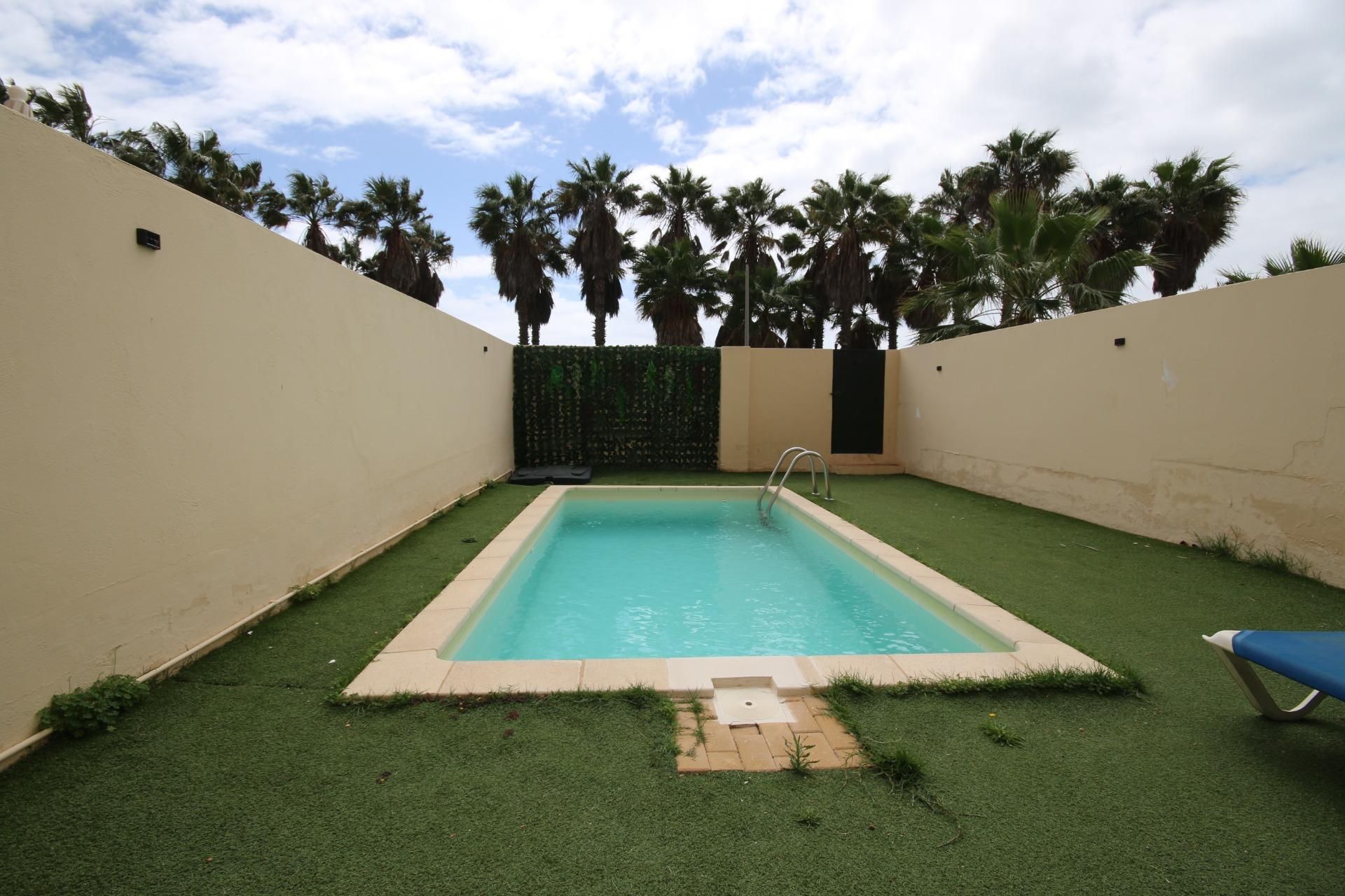 Swimming pool of Planta baja for sale in Ayamonte  with Air Conditioner, Heating and Private garden