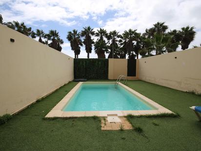 Swimming pool of Planta baja for sale in Ayamonte  with Air Conditioner, Heating and Private garden