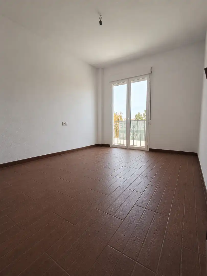 Sala de estar de Casa adosada en venta en La Carlota con Terraza, Horno y Lavadora