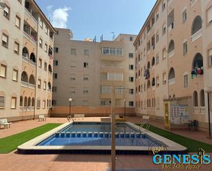 Swimming pool of Flat for sale in Torrevieja  with Air Conditioner, Terrace and Balcony