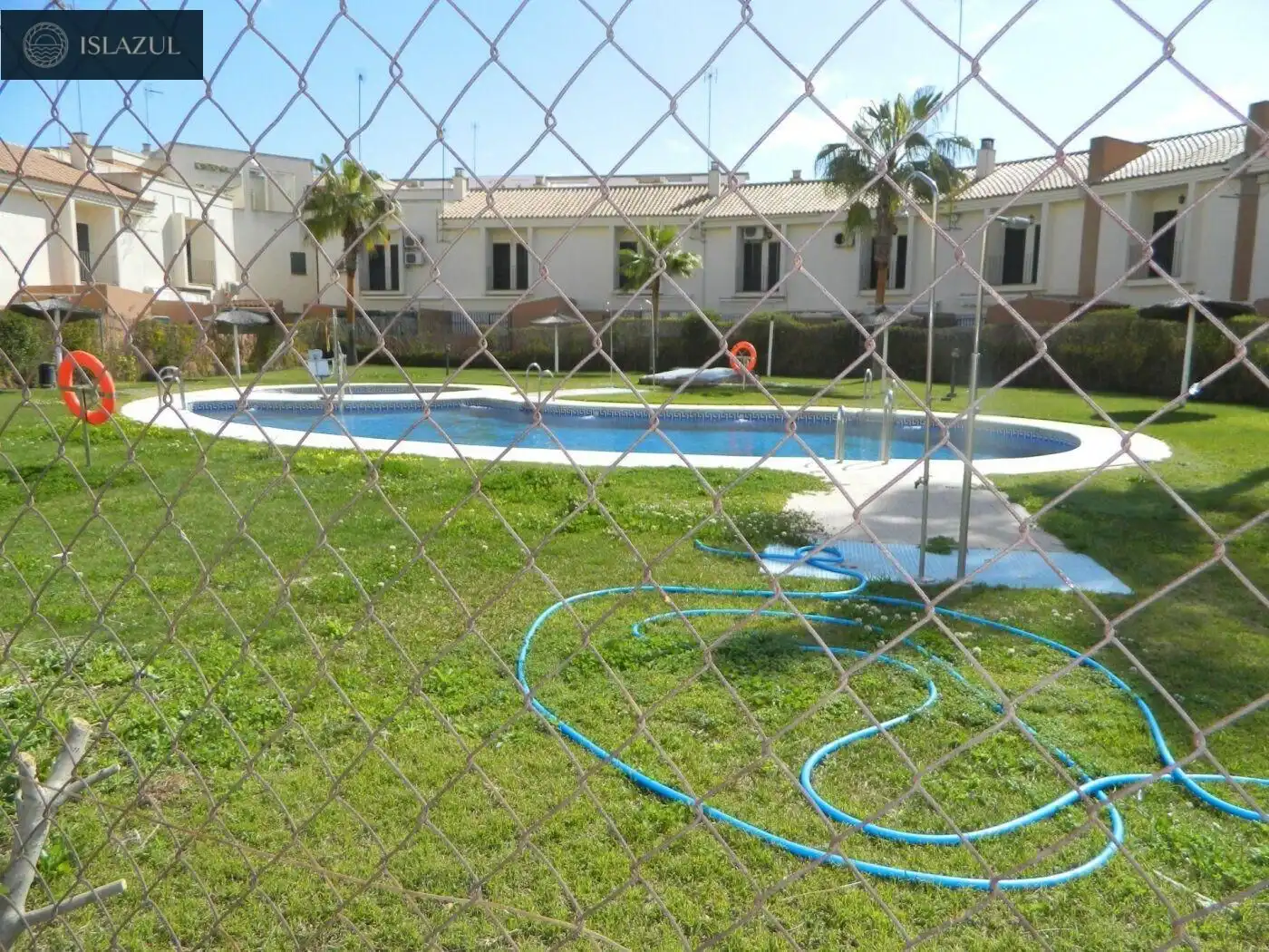 Piscina de Pis de lloguer en Isla Cristina amb Aire condicionat, Jardí privat i Terrassa