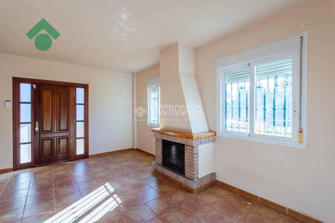 Sala d'estar de Casa adosada en venda en Vélez-Málaga amb Aire condicionat, Jardí privat i Terrassa