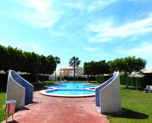 Swimming pool of Single-family semi-detached for sale in Torrevieja  with Air Conditioner, Heating and Terrace
