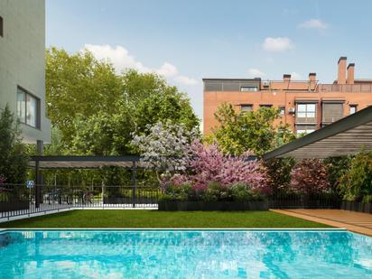 Swimming pool of Flat for sale in  Madrid Capital  with Air Conditioner and Terrace