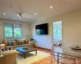 Sala d'estar de Casa o xalet en venda en Punta Umbría amb Aire condicionat, Jardí privat i Parquet