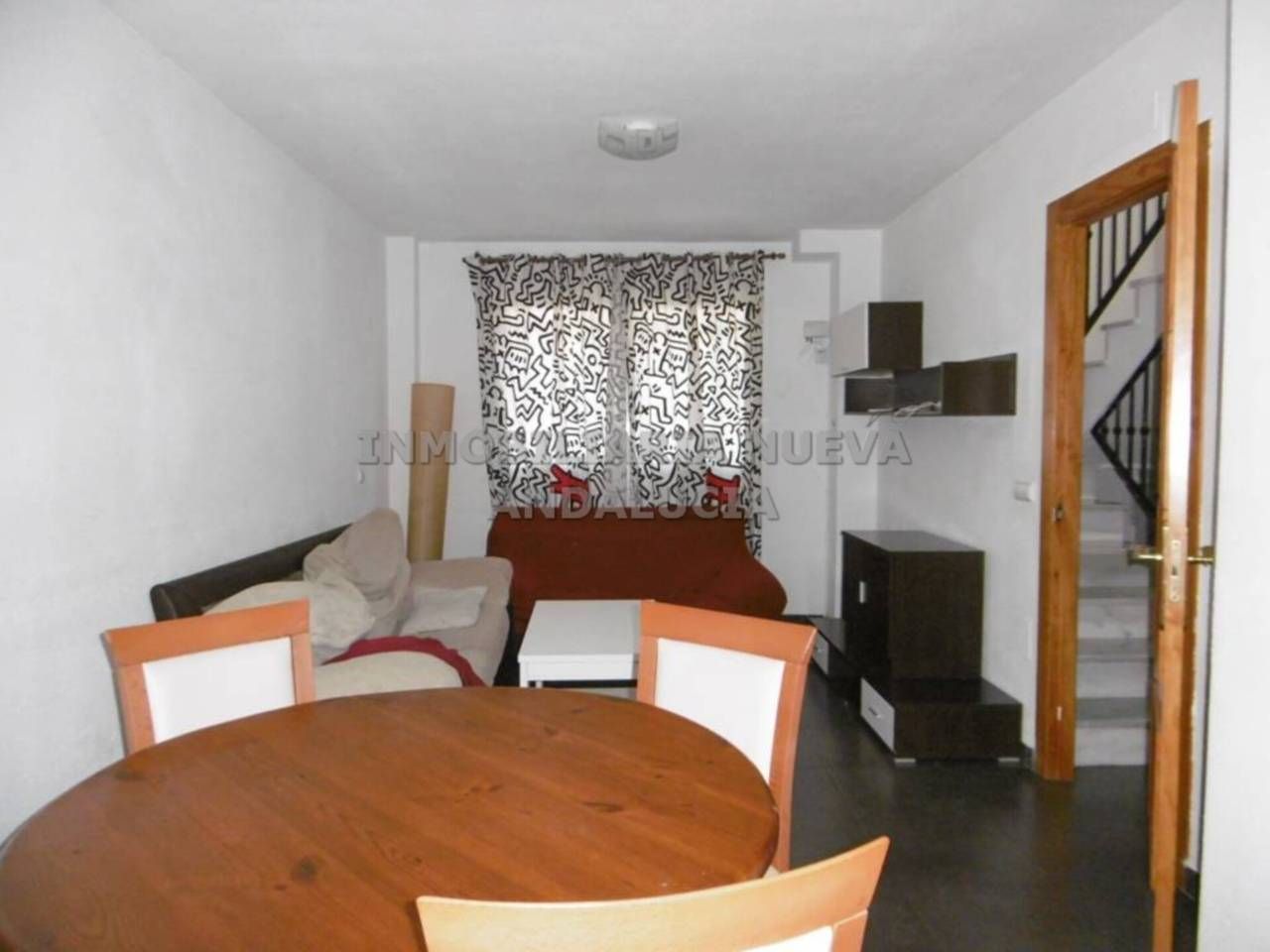 Sala d'estar de Casa adosada de lloguer en  Almería Capital amb Moblat