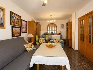 Sala de estar de Casa adosada en venta en Vegas del Genil con Aire acondicionado, Calefacción y Jardín privado