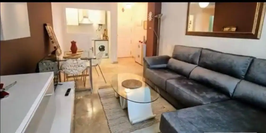 Sala d'estar de Apartament en venda en Manilva amb Aire condicionat, Terrassa i Traster