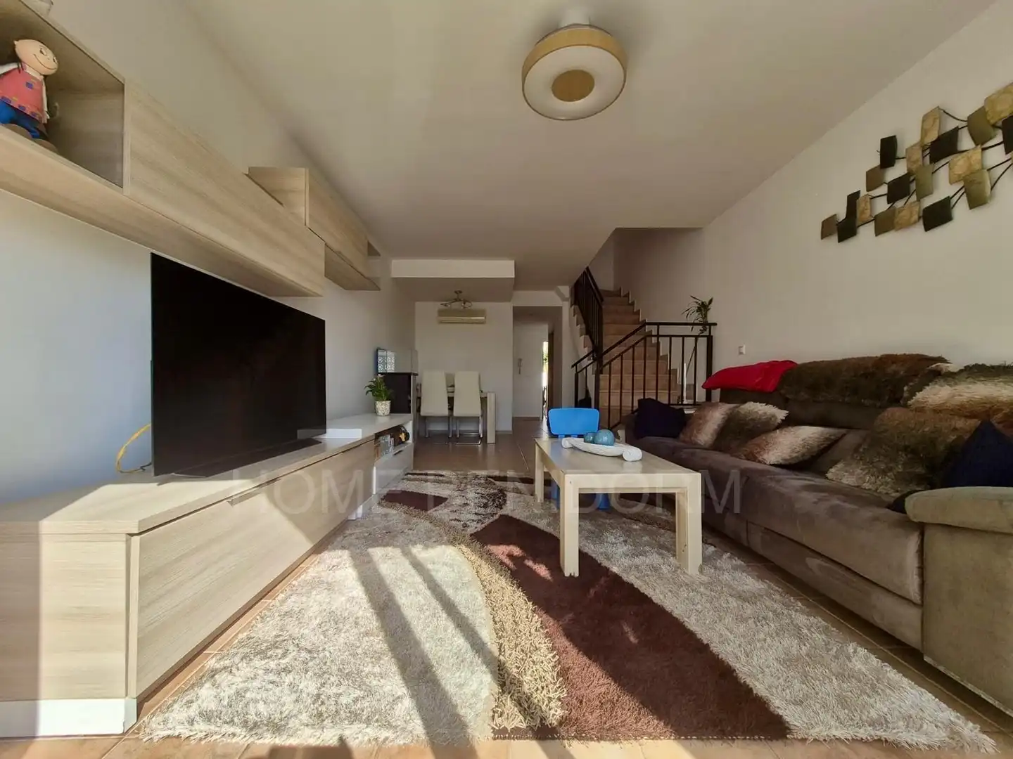 Sala de estar de Casa adosada en venta en Finestrat con Jardín privado y Piscina comunitaria