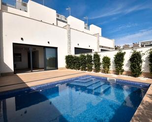 Swimming pool of Single-family semi-detached for sale in Torrevieja  with Air Conditioner, Private garden and Terrace