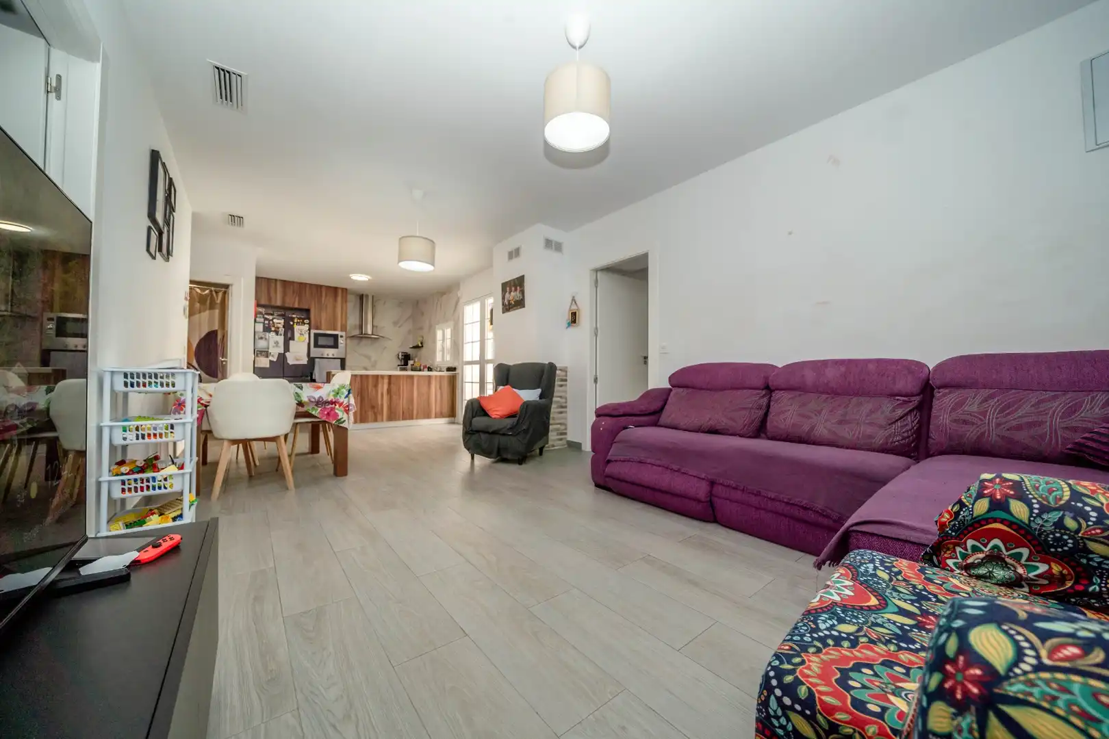 Sala d'estar de Casa adosada en venda en Pilar de la Horadada amb Aire condicionat, Jardí privat i Traster