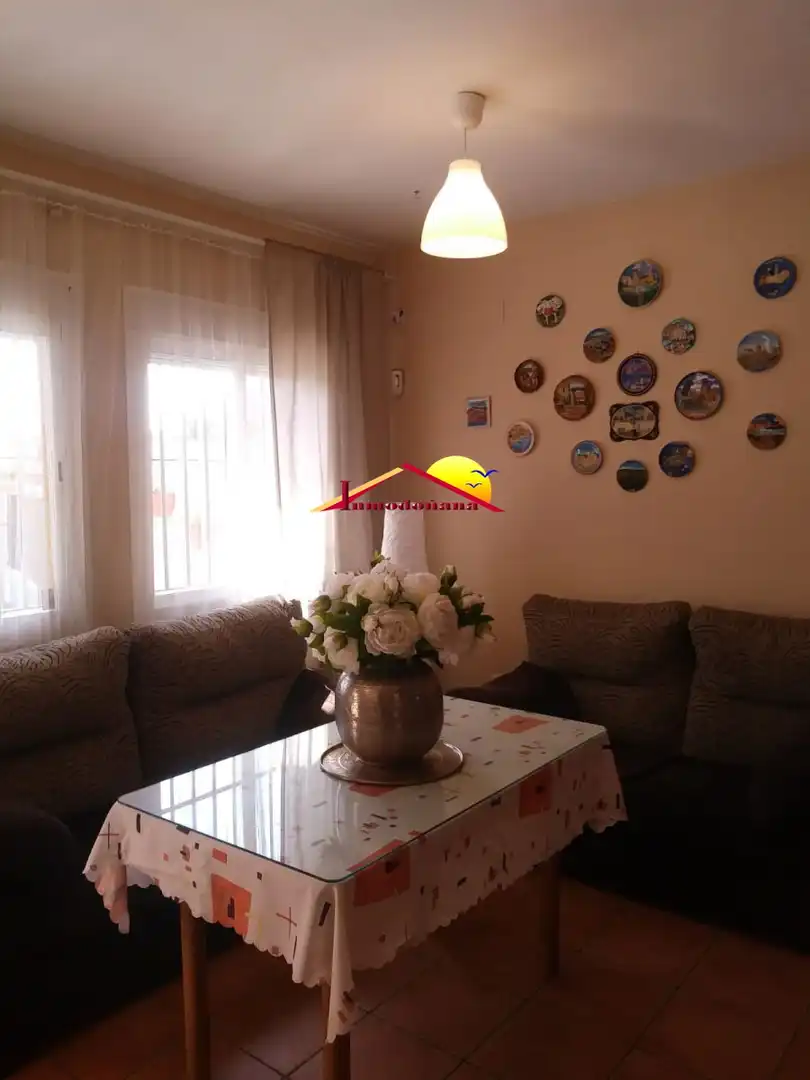 Sala d'estar de Casa adosada en venda en Almonte amb Terrassa, Traster i Moblat