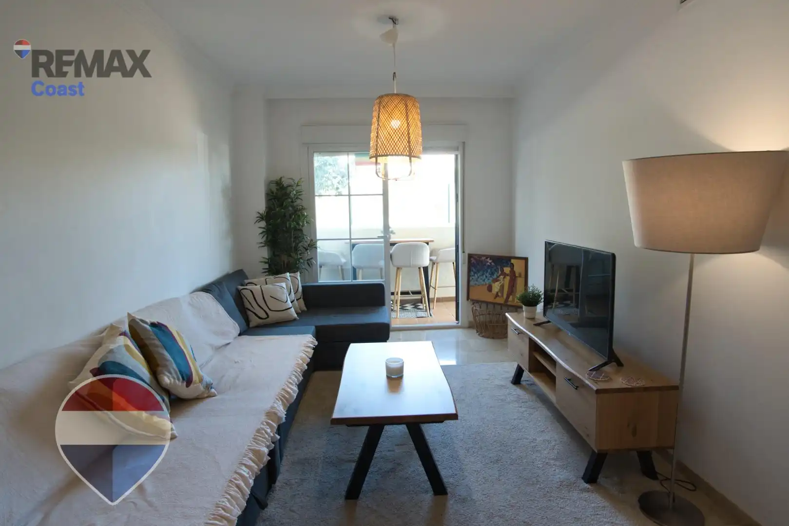 Wohnzimmer von Wohnung zum Verkauf in Benalmádena mit Klimaanlage, Privatgarten und Gemeinschaftspool