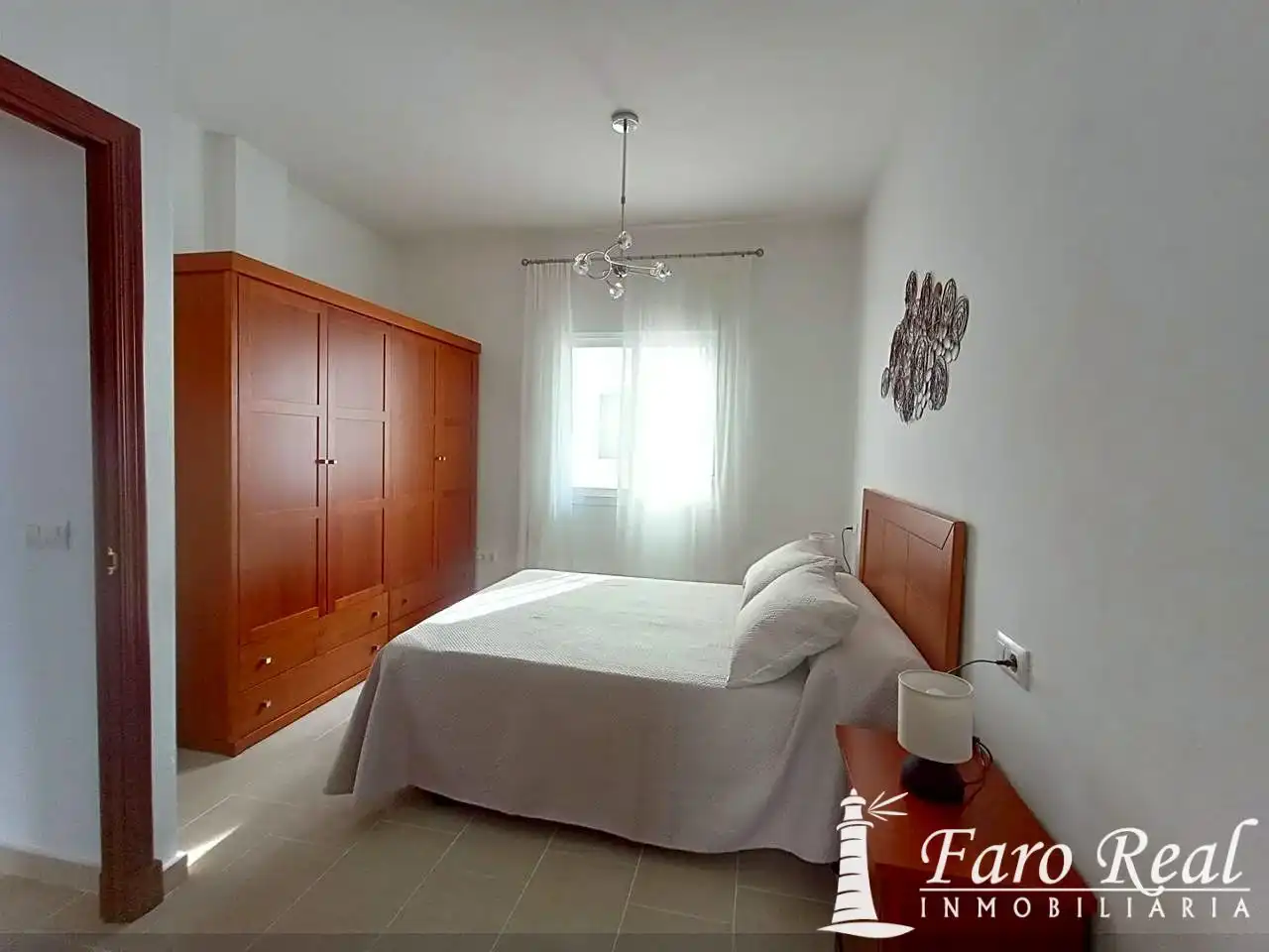 Dormitori de Apartament de lloguer en Sanlúcar de Barrameda amb Aire condicionat i Moblat