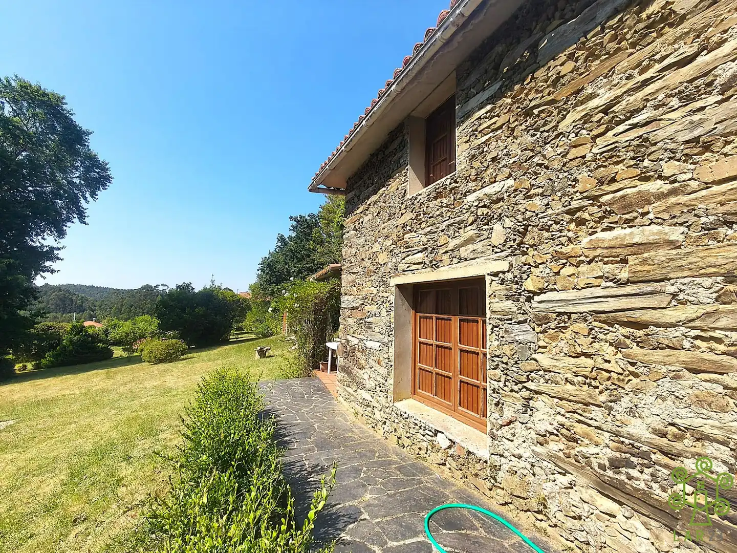 Vista exterior de Casa o xalet en venda en Abegondo amb Calefacció, Jardí privat i Piscina