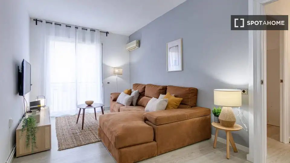 Sala de estar de Piso para compartir en Barcelona con Aire acondicionado, Calefacción y Amueblado