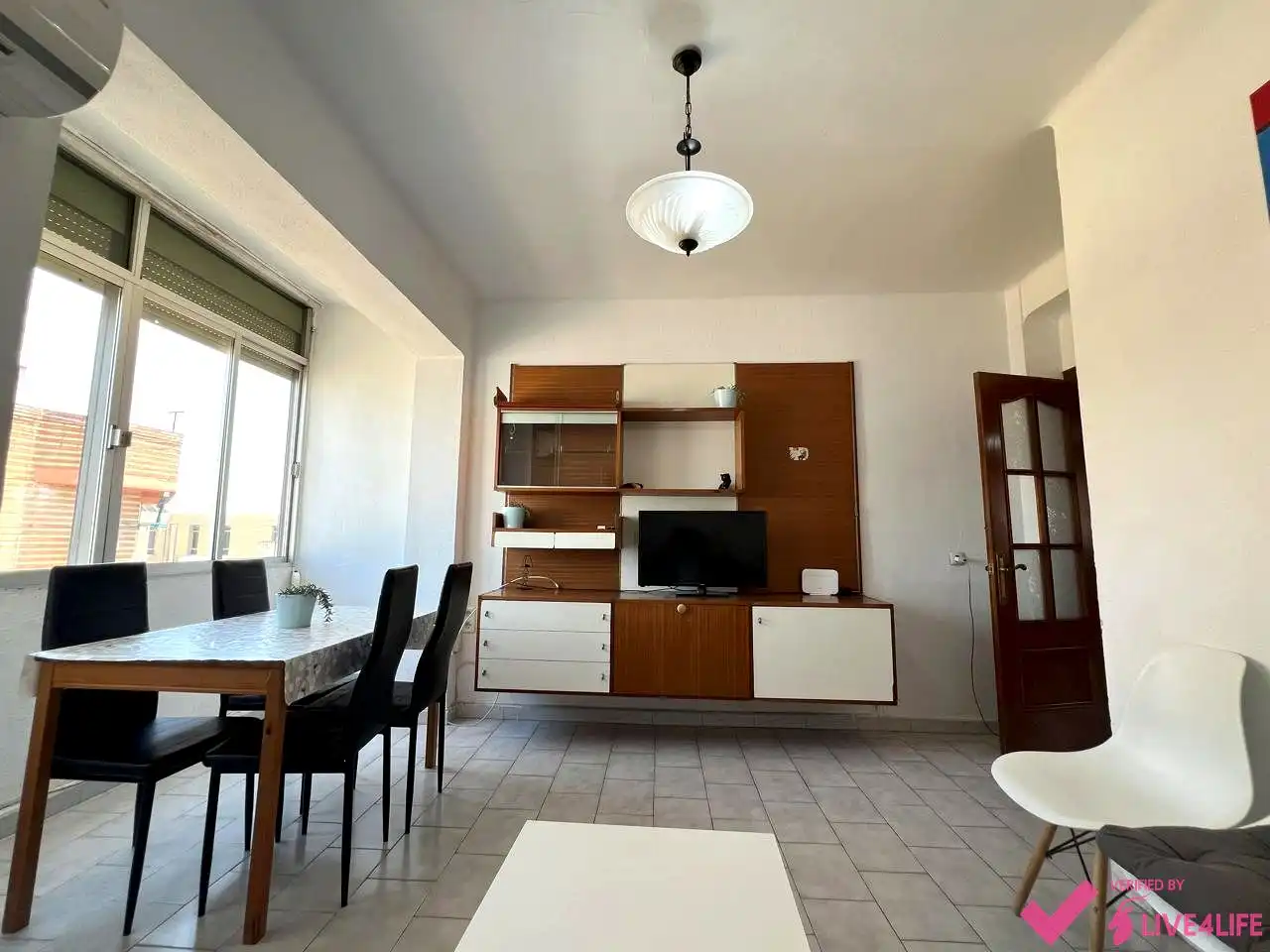Sala de estar de Piso para compartir en Sevilla con Aire acondicionado, Calefacción y Amueblado