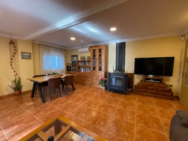 Sala d'estar de Casa o xalet en venda en Alicante / Alacant amb Aire condicionat, Calefacció i Jardí privat