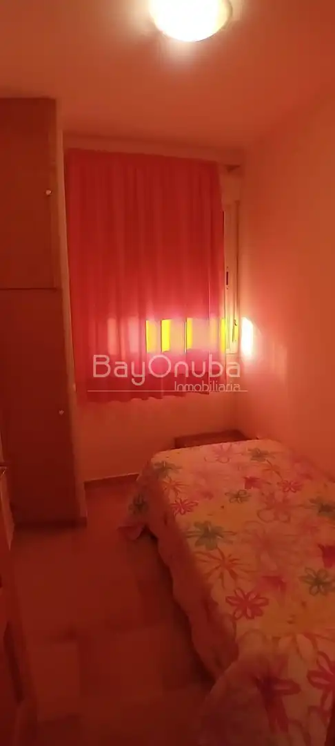 Schlafzimmer von Dachboden zur Miete in Punta Umbría mit Schwimmbad