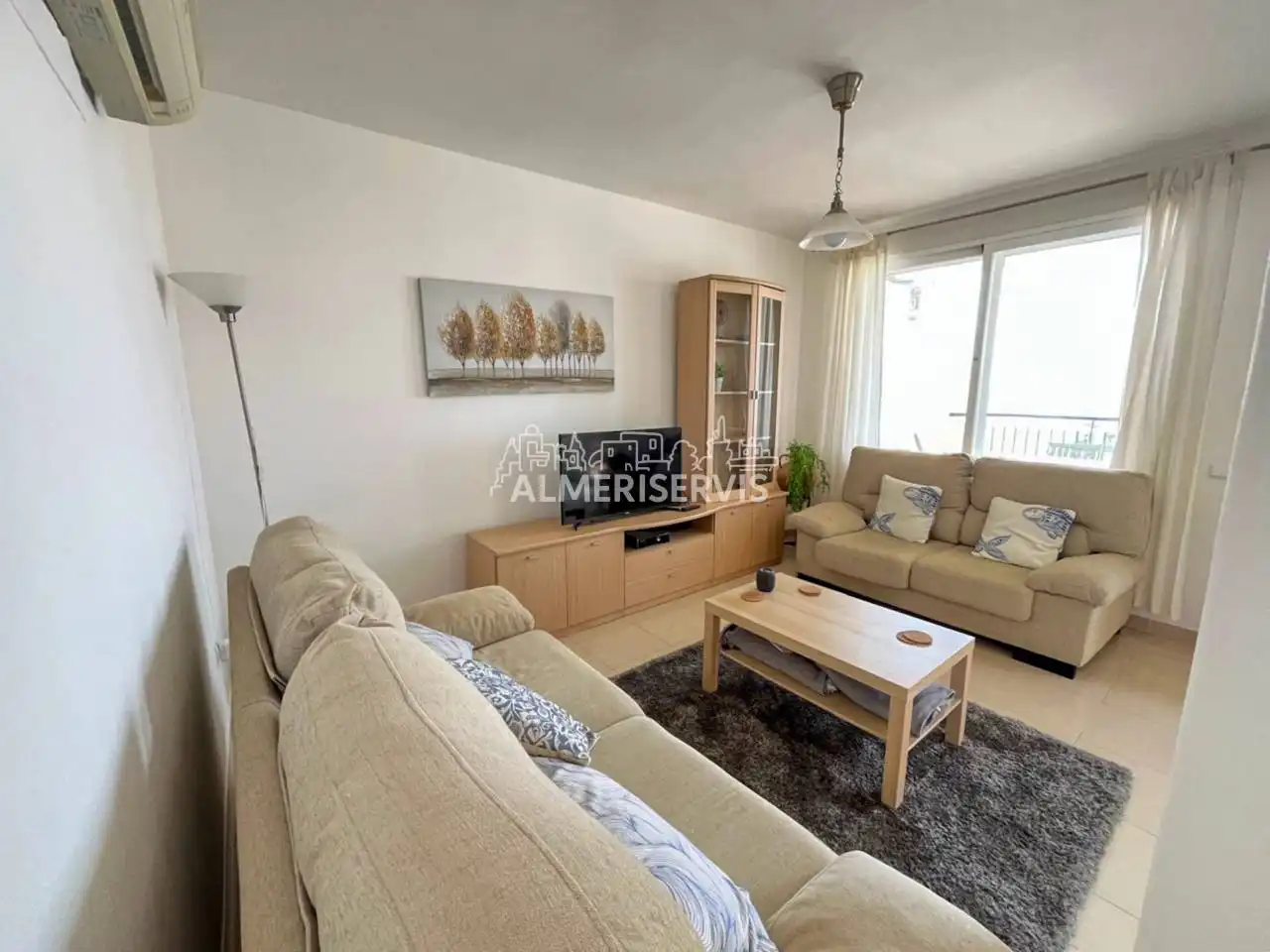 Sala de estar de Casa adosada en venta en El Ejido con Aire acondicionado, Terraza y Amueblado