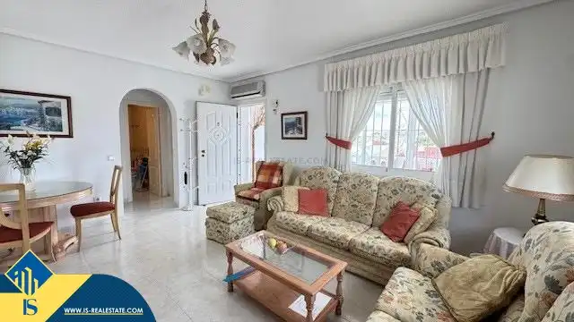 Sala d'estar de Casa o xalet en venda en Rojales amb Jardí privat, Terrassa i Moblat