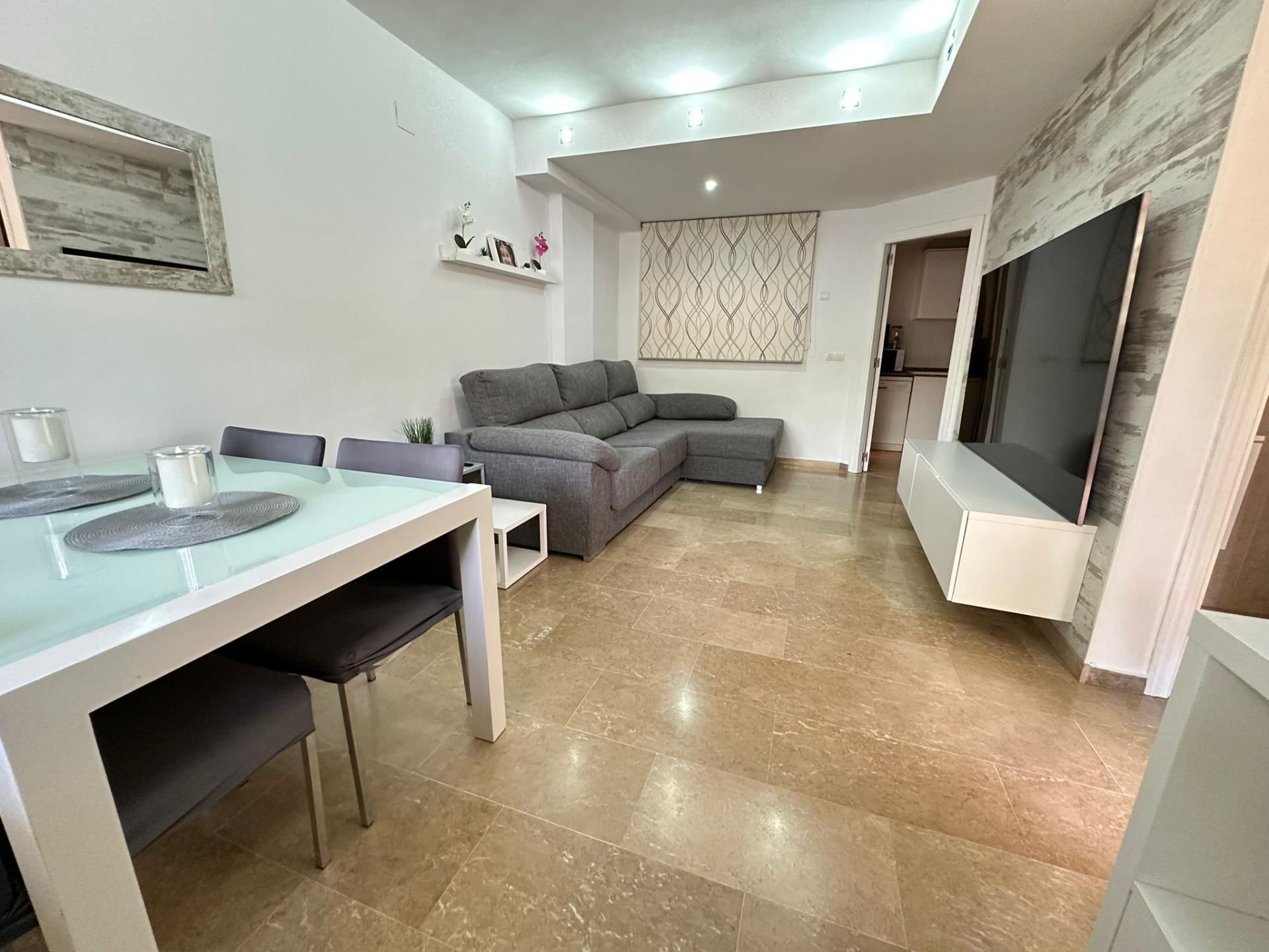 Sala d'estar de Casa adosada en venda en Puçol amb Aire condicionat i Terrassa