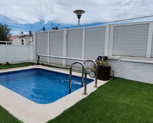Swimming pool of Single-family semi-detached for sale in El Vendrell  with Air Conditioner, Private garden and Terrace