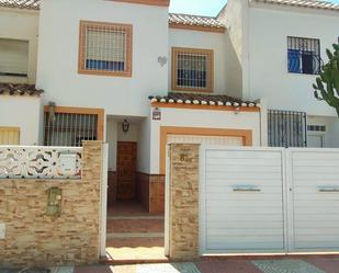 Exterior view of Single-family semi-detached for sale in Roquetas de Mar  with Terrace and Community pool