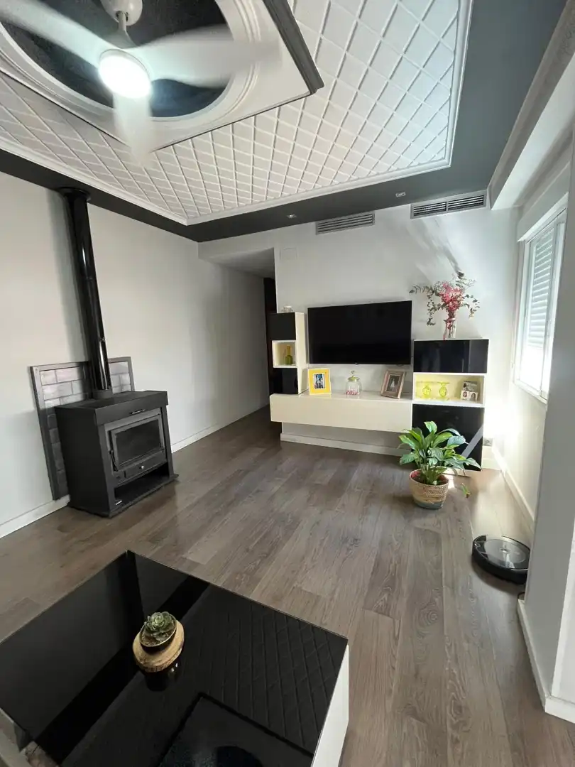 Sala de estar de Casa adosada en venta en El Real de Gandia con Aire acondicionado, Amueblado y Horno