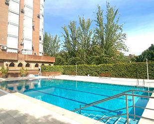 Swimming pool of Flat for sale in  Madrid Capital  with Air Conditioner and Balcony