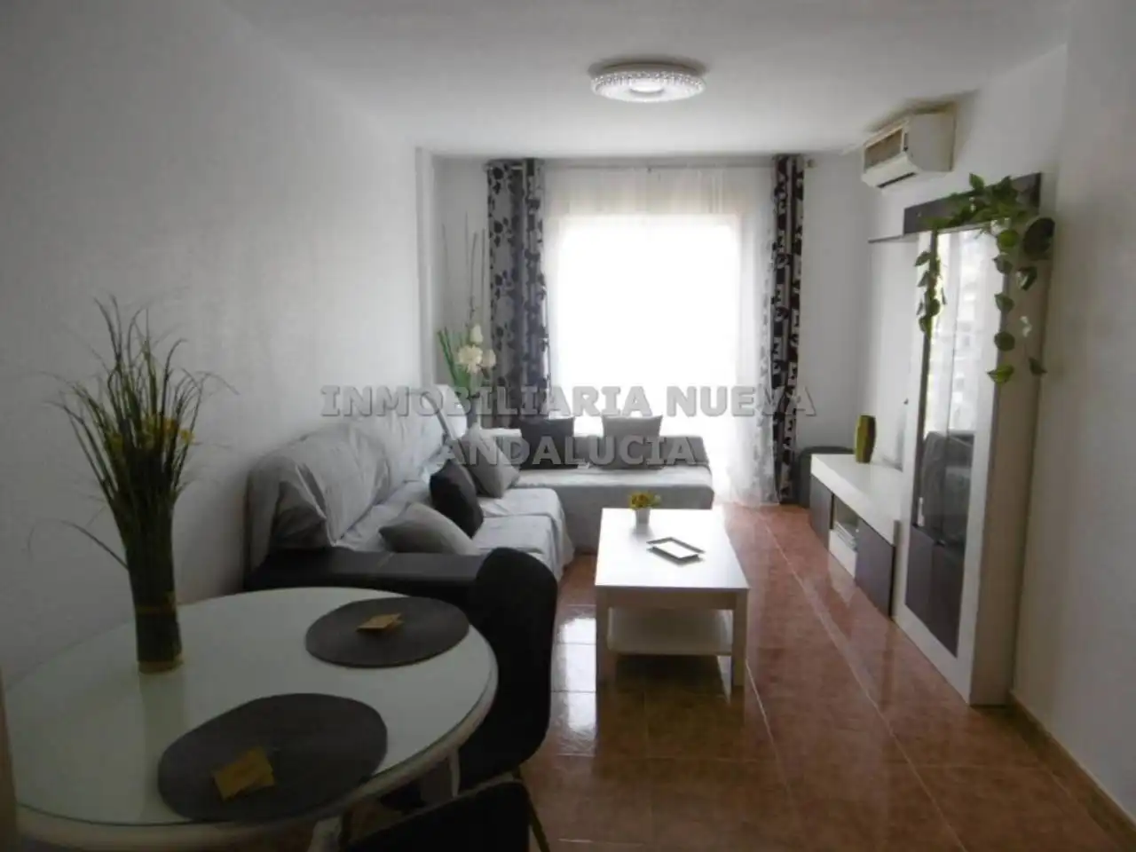 Sala d'estar de Pis de lloguer en Almería amb Aire condicionat i Moblat
