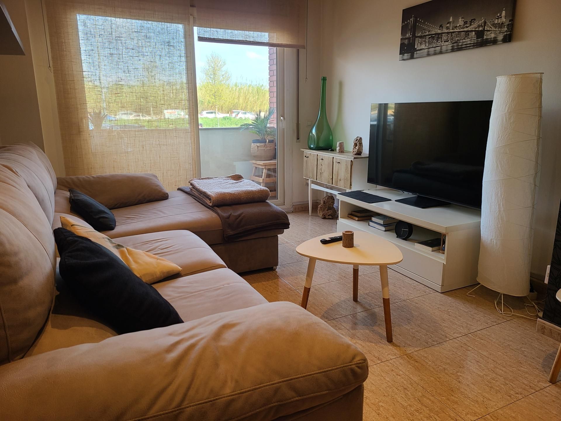 Living room of Planta baja for sale in Figueres  with Air Conditioner, Terrace and Balcony