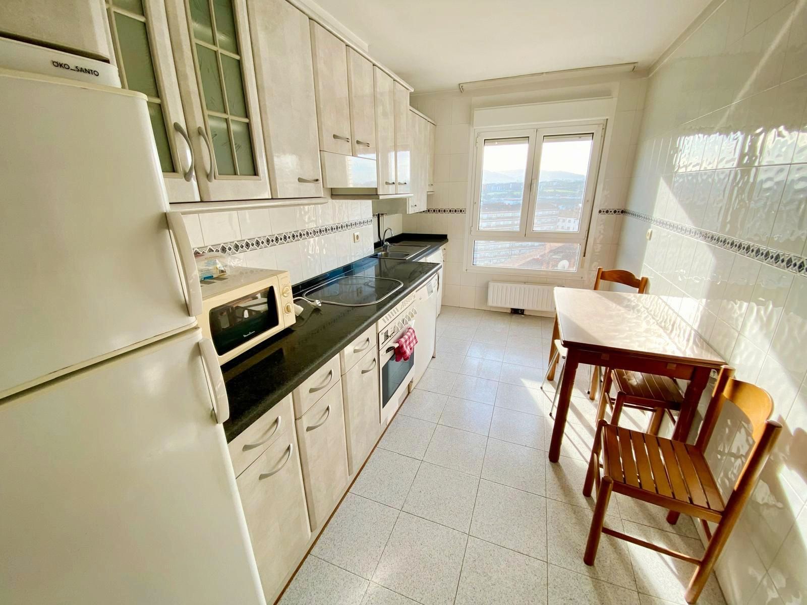 Kitchen of Flat to rent in Gijón   with Heating, Parquet flooring and Storage room