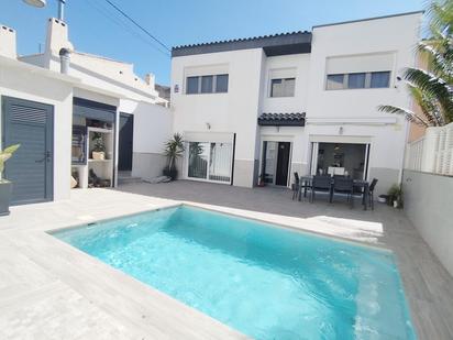 Swimming pool of Single-family semi-detached for sale in Roquetas de Mar  with Air Conditioner and Swimming Pool