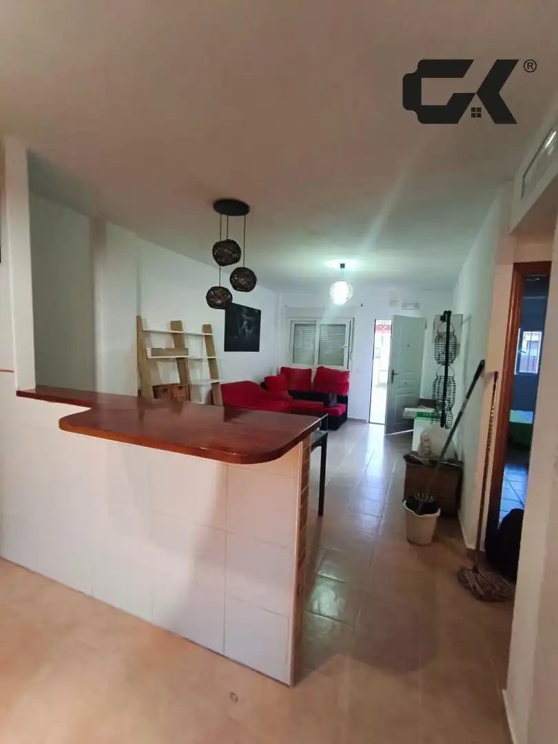 Sala d'estar de Casa adosada en venda en Mazarrón amb Aire condicionat, Jardí privat i Piscina comunitària