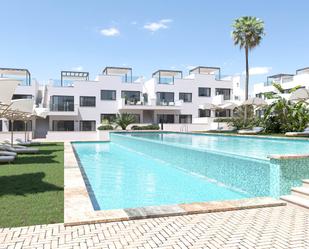 Swimming pool of Flat for sale in Torrevieja  with Air Conditioner, Heating and Private garden