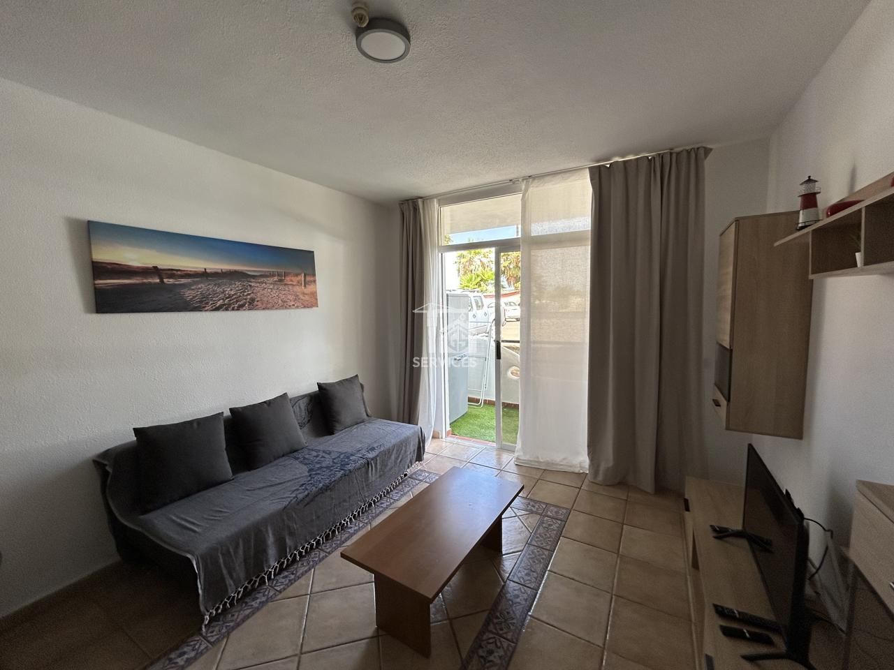 Sala d'estar de Planta baixa en venda en Adeje amb Aire condicionat, Terrassa i Moblat