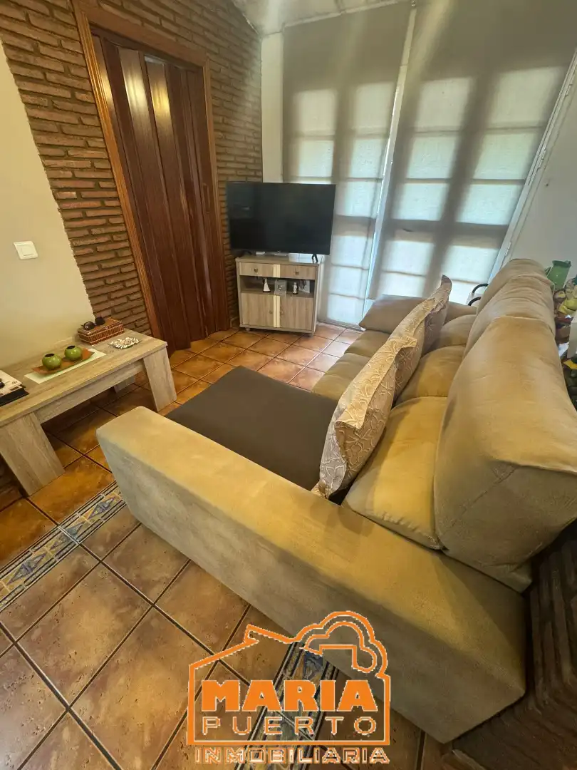 Sala d'estar de Casa adosada en venda en Málaga amb Aire condicionat i Terrassa