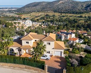 Vista exterior de Casa adosada en venda en Pedreguer amb Aire condicionat i Piscina