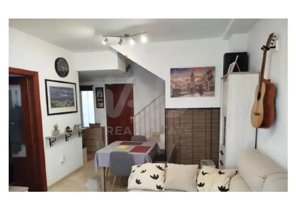 Sala de estar de Casa adosada en venta en Lepe con Calefacción, Terraza y Piscina