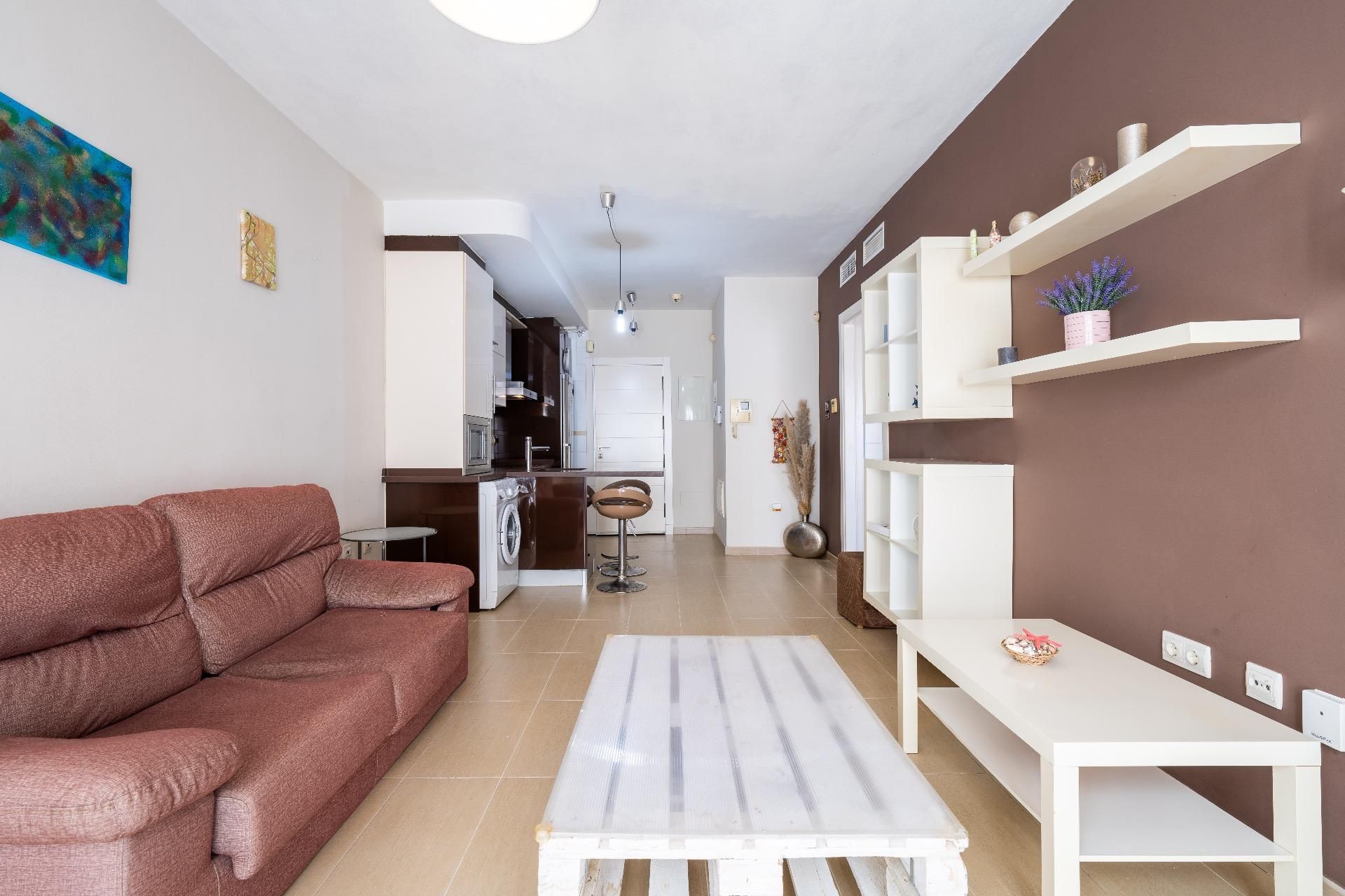 Living room of Flat for sale in  Almería Capital  with Air Conditioner, Private garden and Storage room