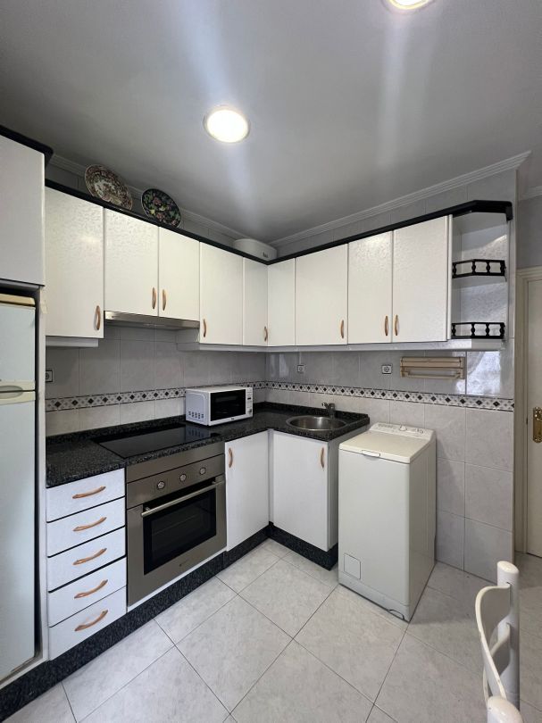 Kitchen of Flat for sale in Gijón   with Parquet flooring, Storage room and Furnished