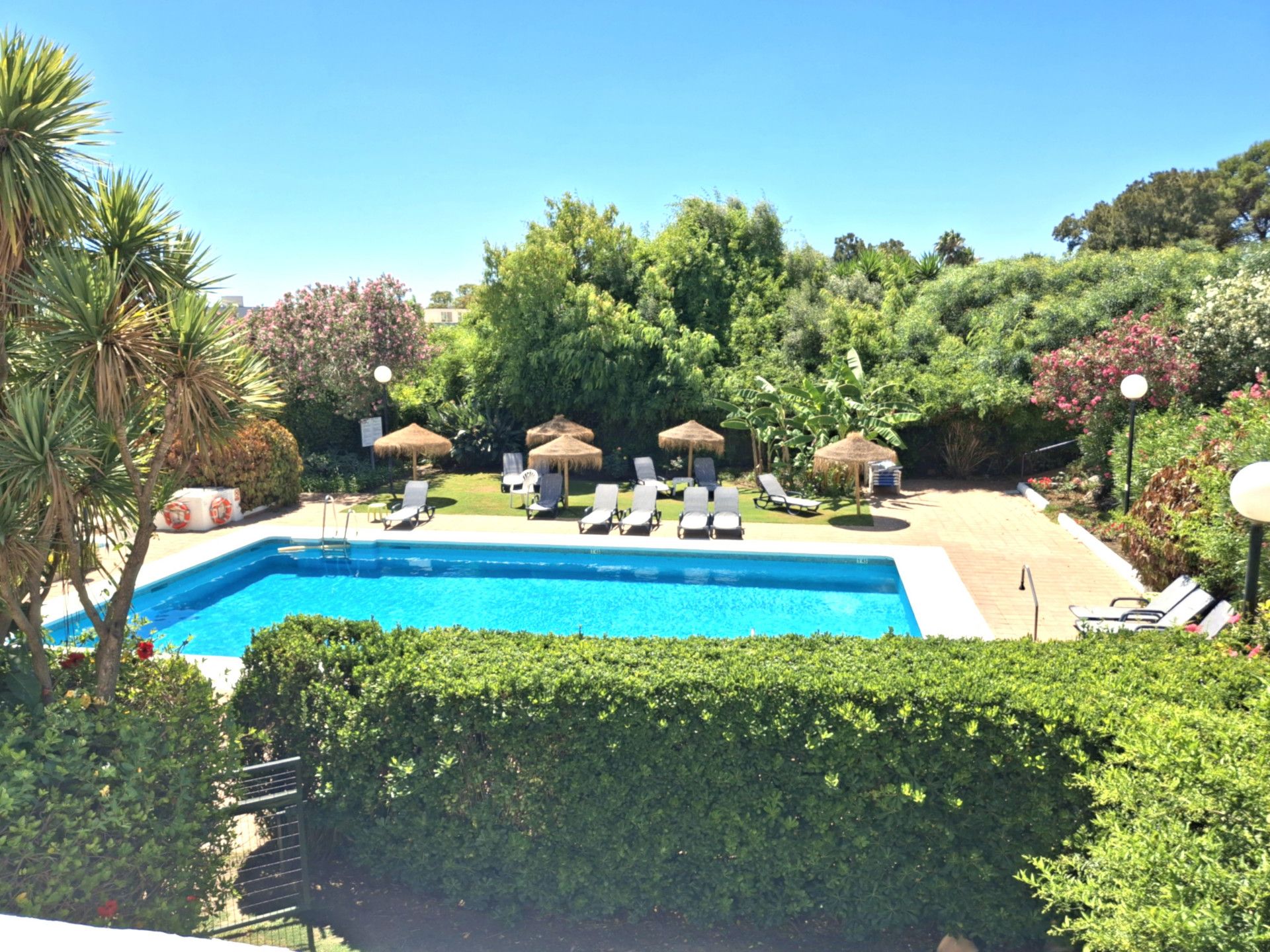 Swimming pool of Apartment for sale in Sotogrande  with Air Conditioner, Heating and Terrace